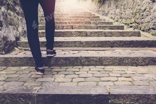 Preview: Woman walking on stair