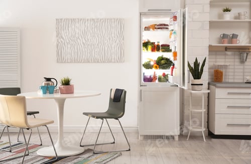 Preview: Stylish kitchen interior with refrigerator full of products