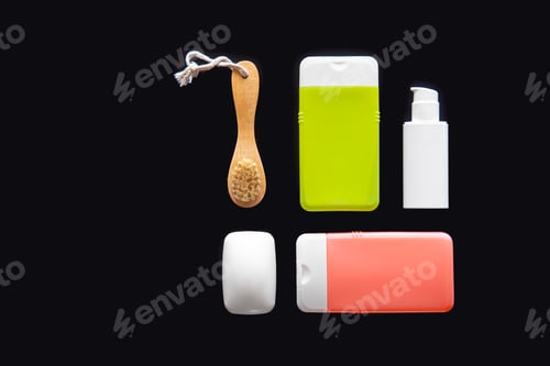 Preview: Flat lay spa composition with skin care products on black background.