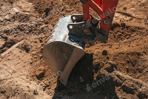 Preview: Excavator shovel digging on dirt