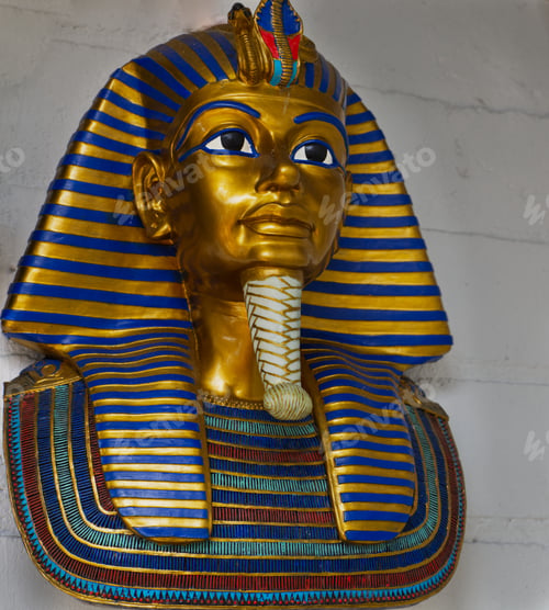 Preview: Golden and blue Egyptian statue hung from a white wall