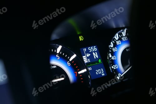 Preview: close up of car meter in dark,