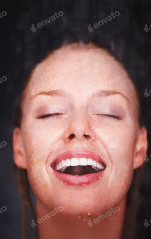 Preview: Closeup of a woman enjoying a bath against black