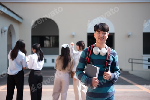 Preview: A smiling college student with a red backpack standing on campus