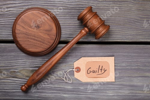 Preview: Wooden gavel and guilty verdict.
