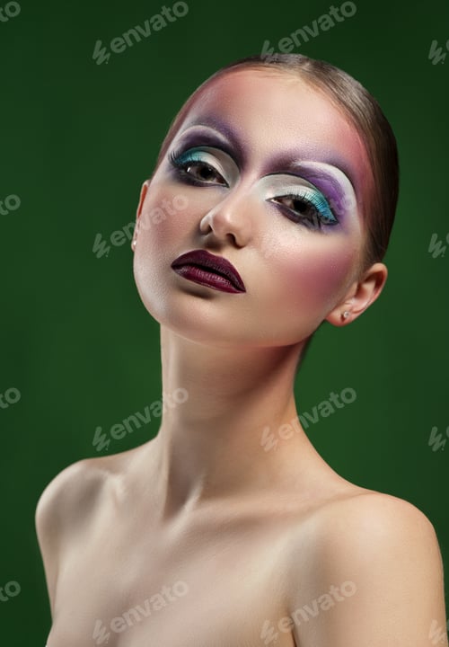Preview: Female wearing art makeup studio shots