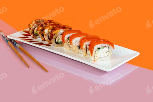 Preview: Sushi sets, rolls with caviar, shrimp, tuna and avocado and Philadelphia cheese, on a white plate.