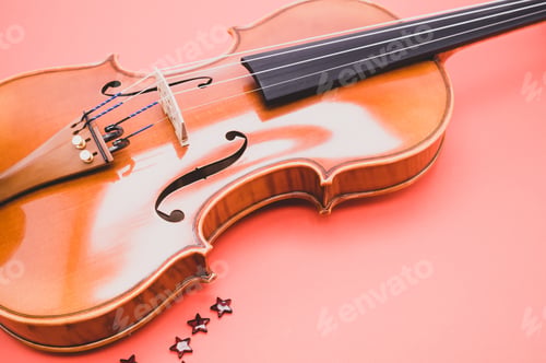 Preview: Closeup of a violin on a pink background
