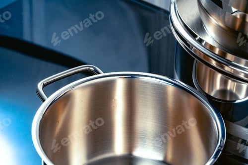 Preview: Set of aluminum pans on black surface close up