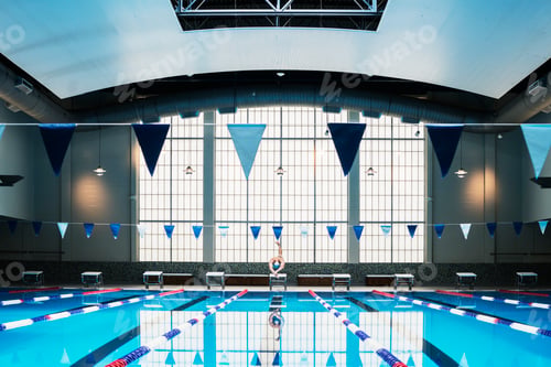 Preview: Man diving into indoor swimming pool.