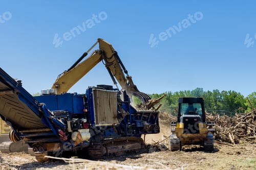Preview: With the help of an industrial shredder machine, we are shredding the roots of the roots on the land