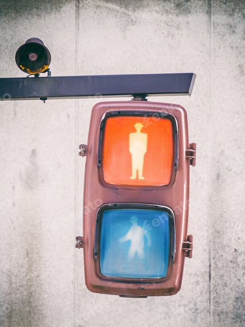 Preview: Vertical shot of an electric pedestrian crosswalk sign with green and red lights