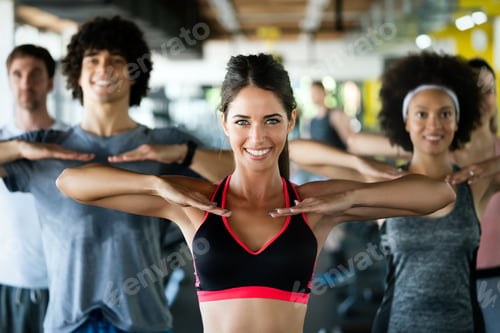Preview: Diversity group of people training in a gym. Trainer and sportive persons exercising
