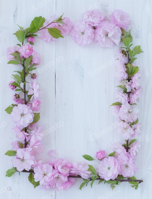 Preview: Flowers frame on white wooden