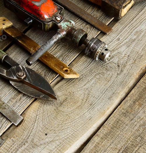 Vintage Tools on Weathered Wooden Surface