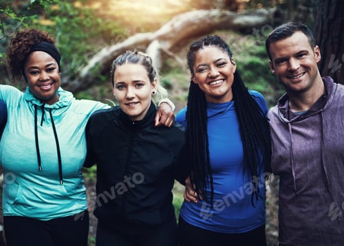 Preview: Portrait of a group of sporty young friends standing in a row while working out in the forest