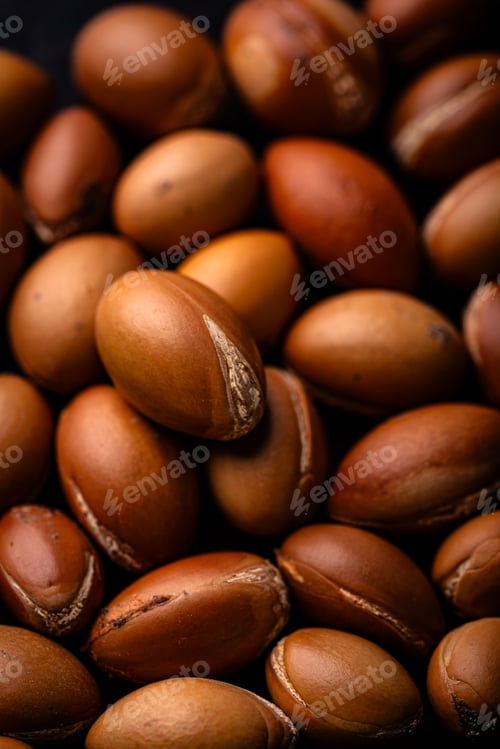 Preview: Pile of brown argan nuts texture