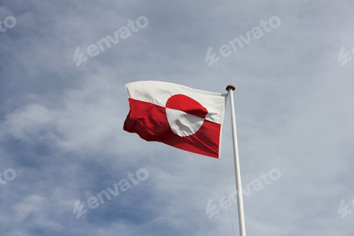 Preview: Beautiful shot of the flag of Greenland waving in the sky.
