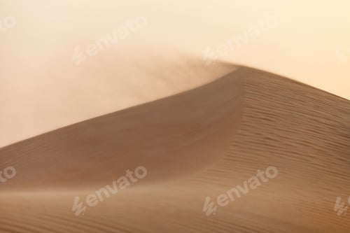 Preview: Wind blowing sand at the top of the sand dune in the desert in UAE