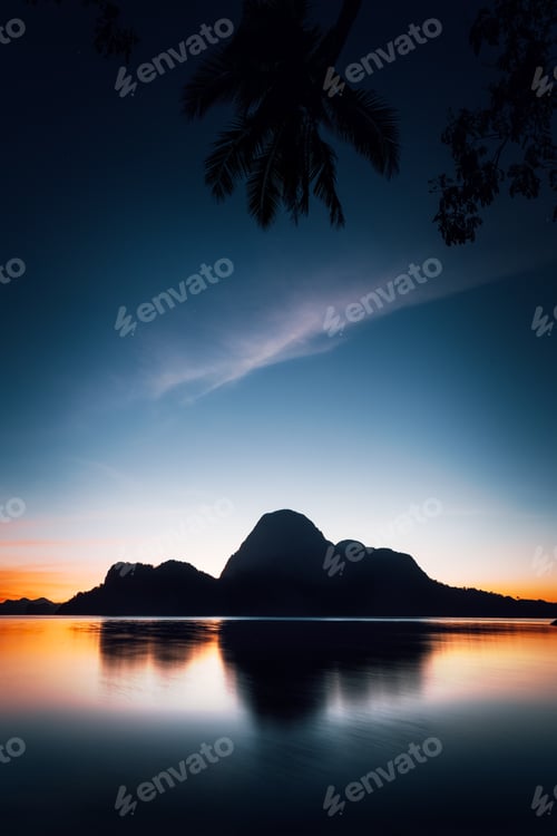 Preview: El Nido silhouette of beautiful Cadlao Island in dusk light after sunset in Palawan Island