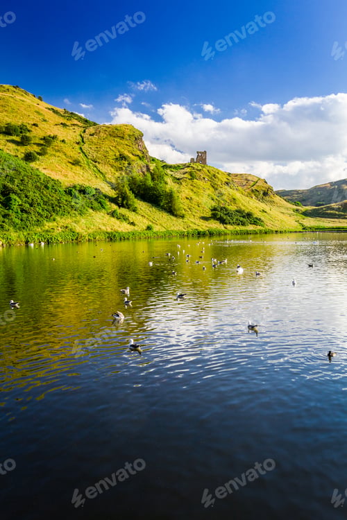 Preview: View of the mountains reflected in a lake in summer