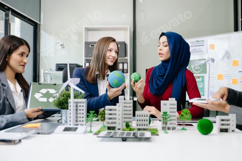 Preview: Business people having consultation about wind energy at company office. Business team discussing