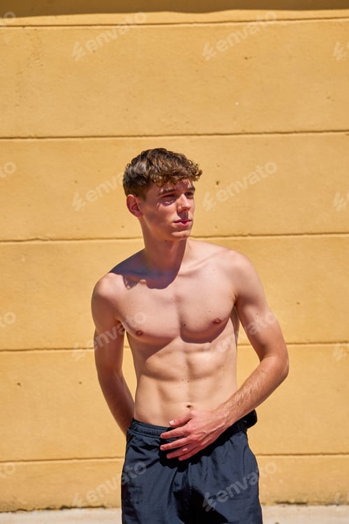 Preview: Male athlete resting after training outdoors