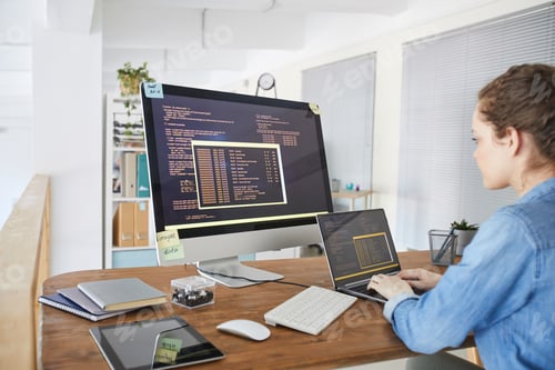 Preview: Female IT Developer Writing Code at Workplace