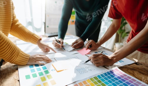 Preview: UX developer and ui designer brainstorming about mobile app interface wireframe design with customer
