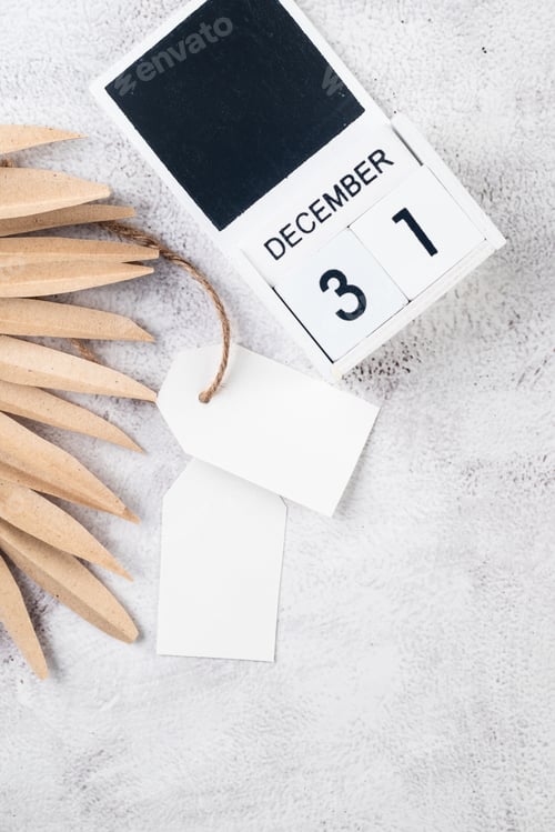 Preview: White blank paper tag or label with christmas gift box red Christmas decor on grey conkrete