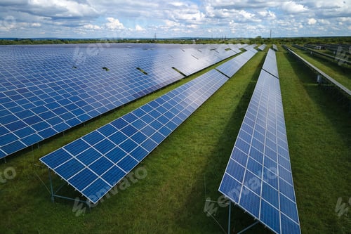 Preview: Aerial view of big sustainable electric power plant with many rows of solar photovoltaic