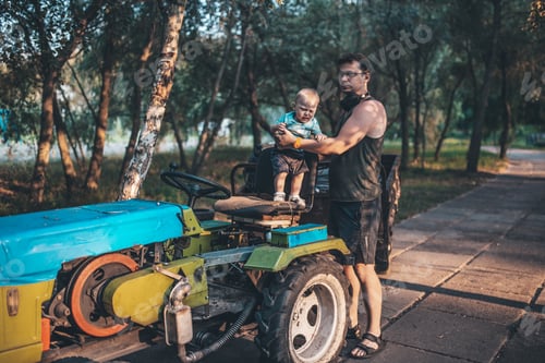 Preview: father and son walking in the park