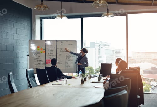 Preview: Shot of an executive giving a whiteboard presentation to a group of colleagues in a boardroom