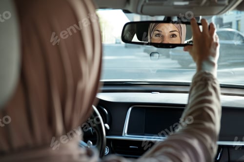 Preview: Reflection of part of Muslim female face in mirror