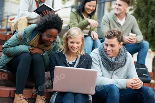 Preview: Shot of a group of smiling university students looking at something on a laptop