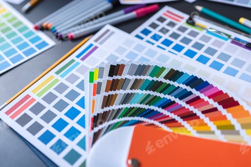 Preview: Color swatches of graphic designers putting on desk table.