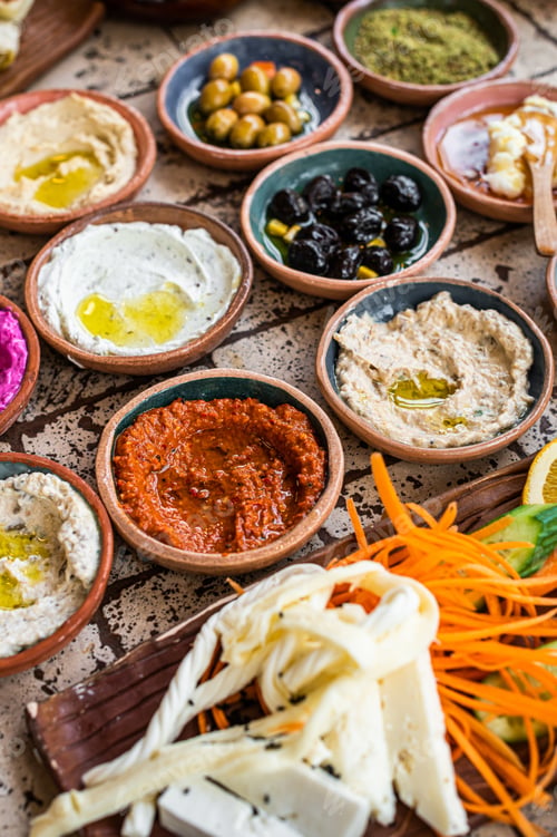 Preview: Traditional Turkish Village Breakfast on the ceramic table with pastries, vegetables, greens