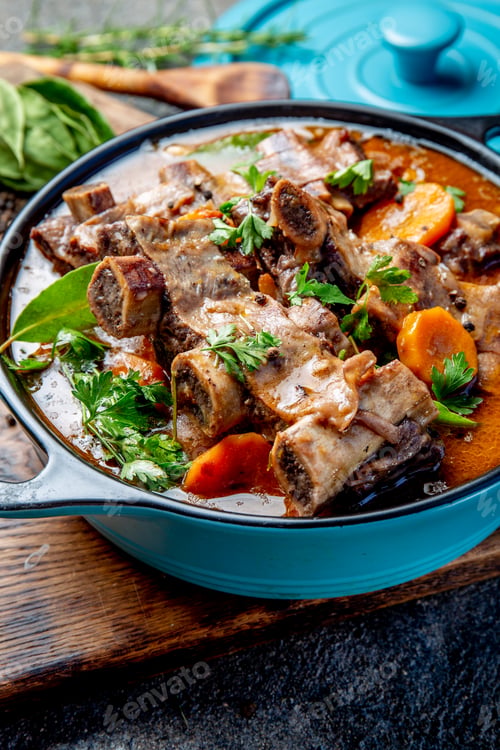 Preview: Beef ribs Bourguignon. Beef ribs stewed with carrot, onion in red wine. France dish. Top view