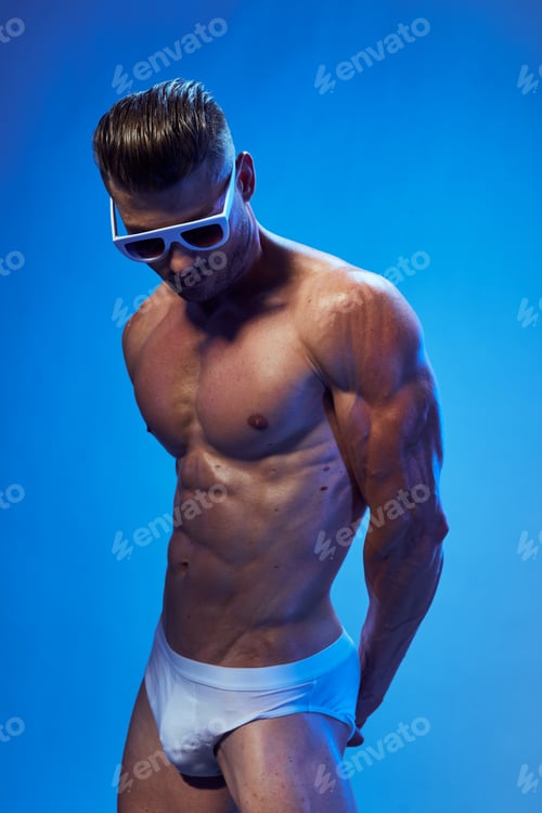 Preview: portrait of a naked man with pumped up muscles and shorts