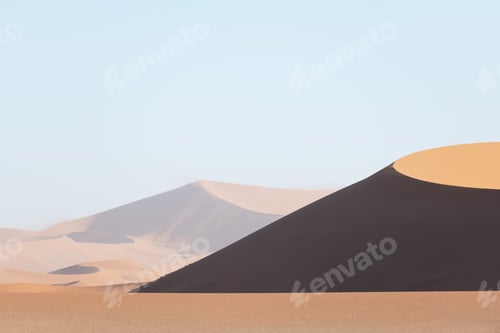 Preview: Orange sand dunes and clear sky in Namib desert