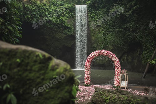 Preview: Wedding ceremony on small secret waterfall Tibumana in Bali, Indonesia jungle. CLassic round arch