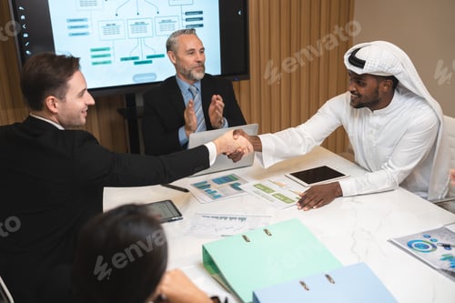 Preview: Emirate man having business deal agreements with partnership team, Arabian manager making handshake