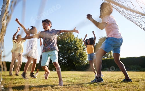 Preview: Celebrating goal at a multi generation family football game