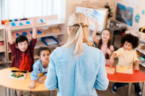 Preview: Selective focus of teacher conducting lesson with kids in montessori school