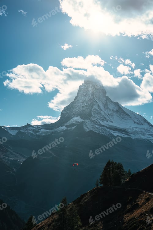 Preview: Matterhorn mountain with tourist playing parachute on blue sky in daylight at Switzerland