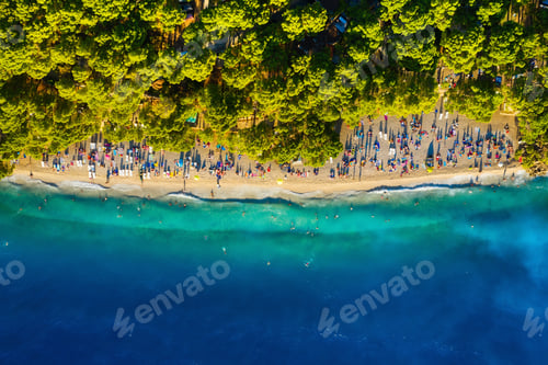 Preview: Mediterranean sea. Aerial view on beach and people. Vacation and relax. Beach and blue water.