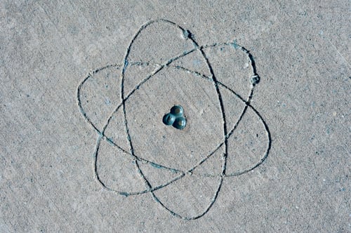 Preview: Atomic Simbol on concrete floor. Knowledge. Concept background.