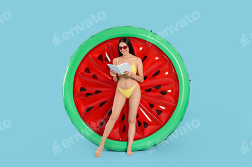 Preview: Young woman with book near inflatable mattress against light blue background