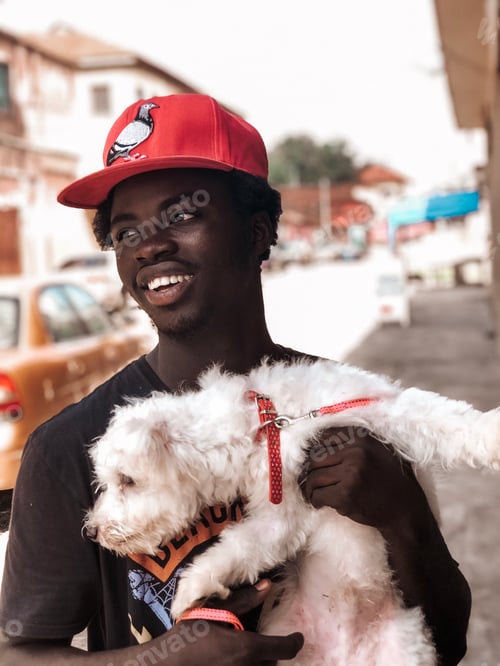 Preview: A young male holding his pet