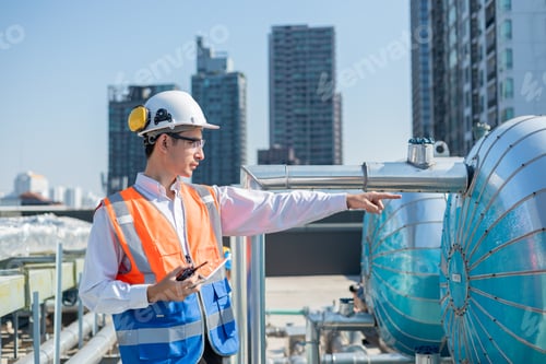 Preview: Engineer under industrial inspection Large water heaters are used in high-rise condominiums.